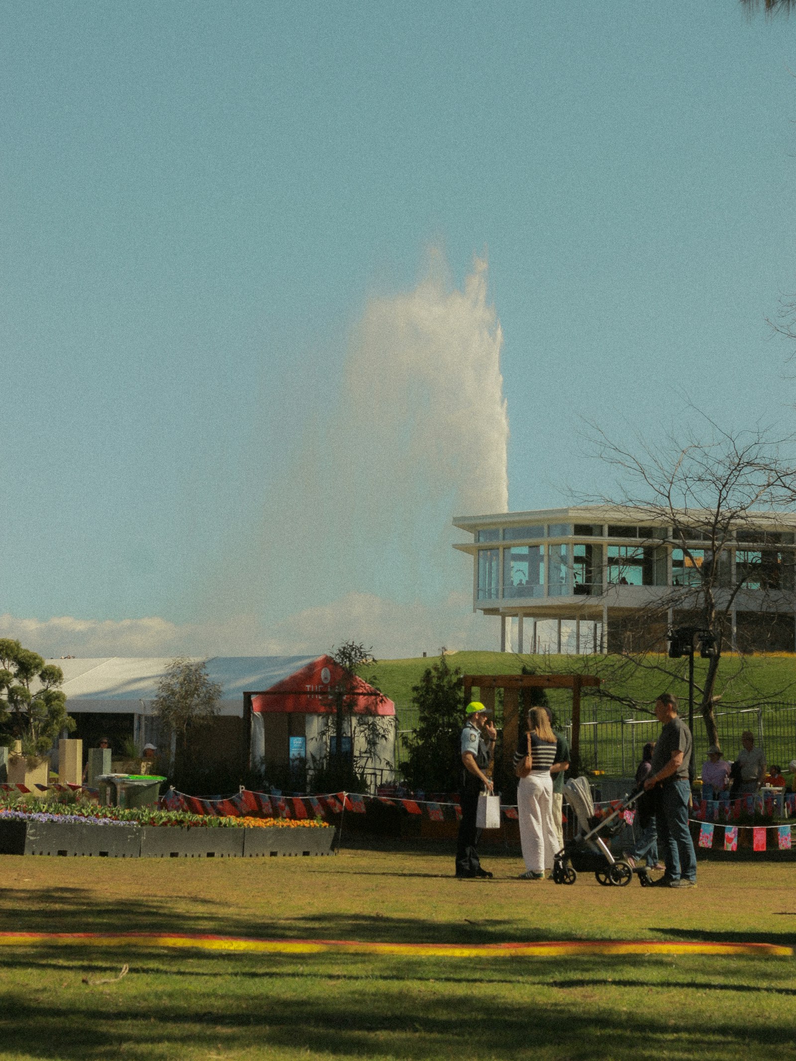 People gathering at a spring festival with flowers